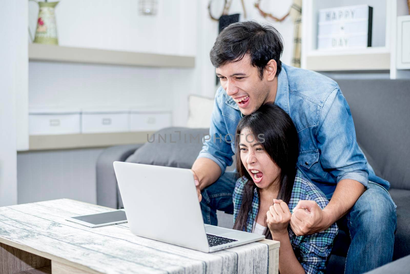 Lover are surprising when using the laptop. Family concept, Lovers concept, Technology concept