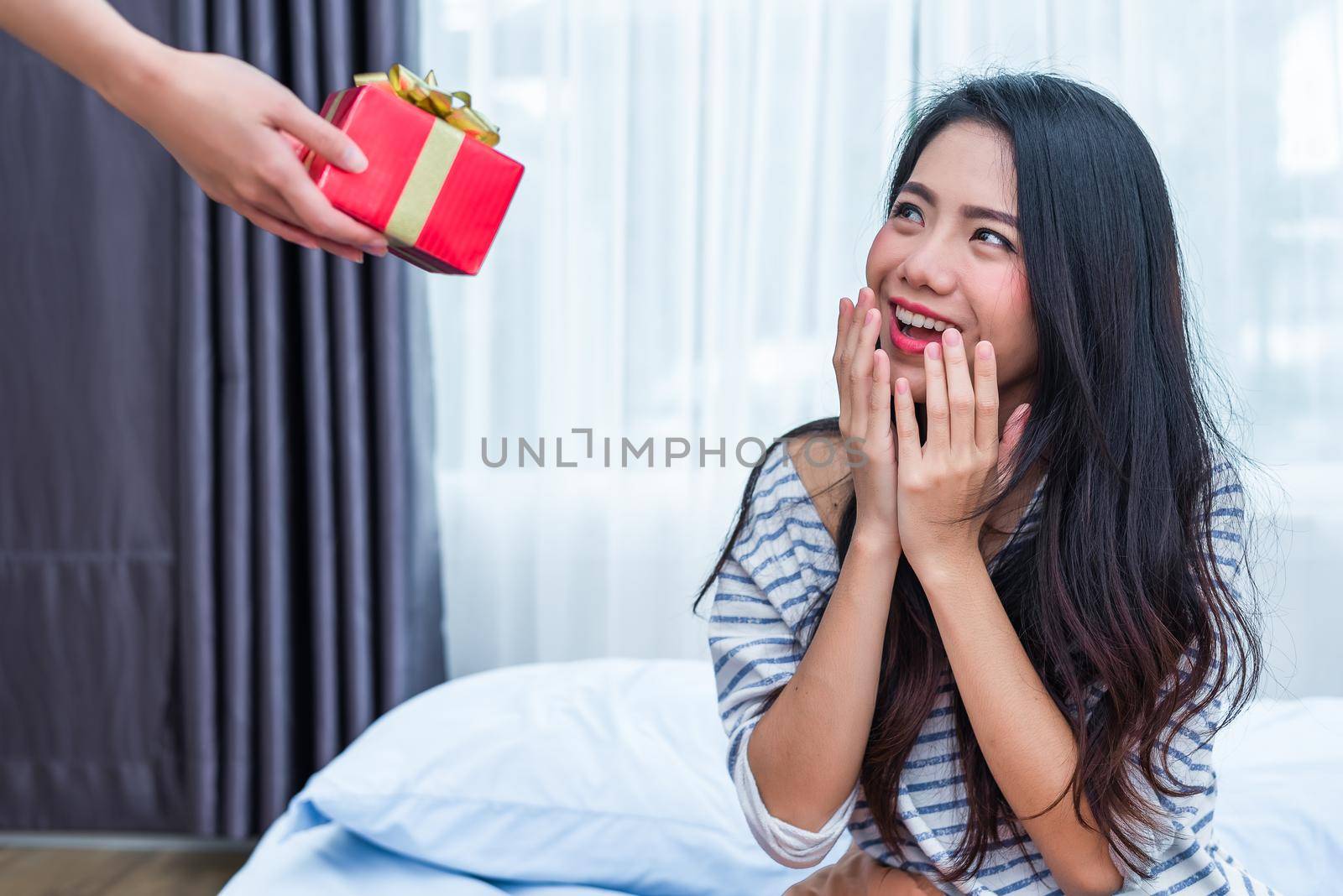 Asian woman surprised by the birthday gifts. People and lifestyles concept. Valentine and Birthday theme. Wedding and engagement theme. Happiness emotion