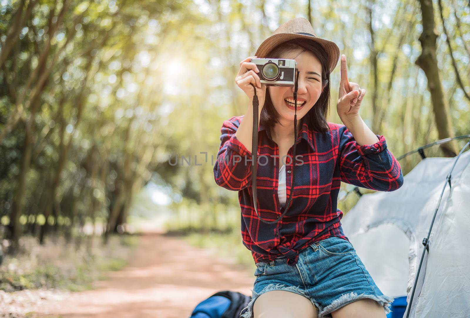 Asian beauty traveler taking photograph by digital cemera while hiking camping. Adventure and leisure activity concept. Happy life and technology theme. Solo girl theme. by MiniStocker
