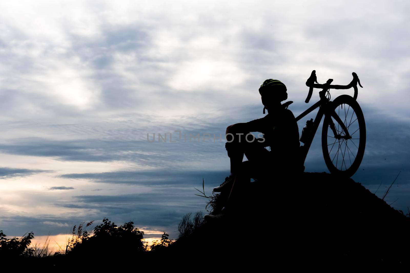 Silhouette Bicycle cycling man on the hill. Relax and sport concept