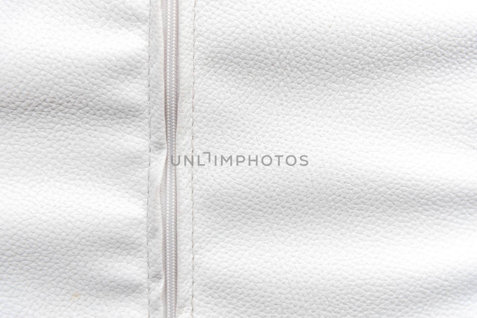 White leather with zip background. Wallpaper and Texture concept. Close up of material theme. by MiniStocker