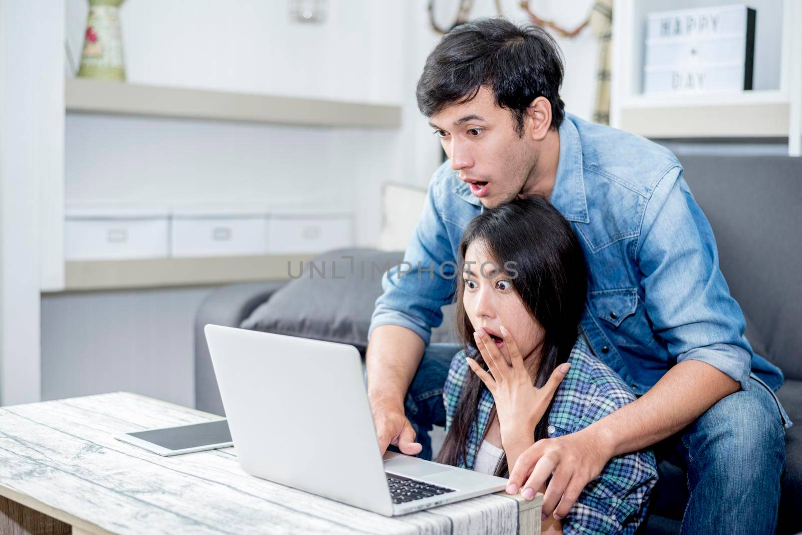 Lover are surprising when using the laptop. Family concept, Lovers concept, Technology concept