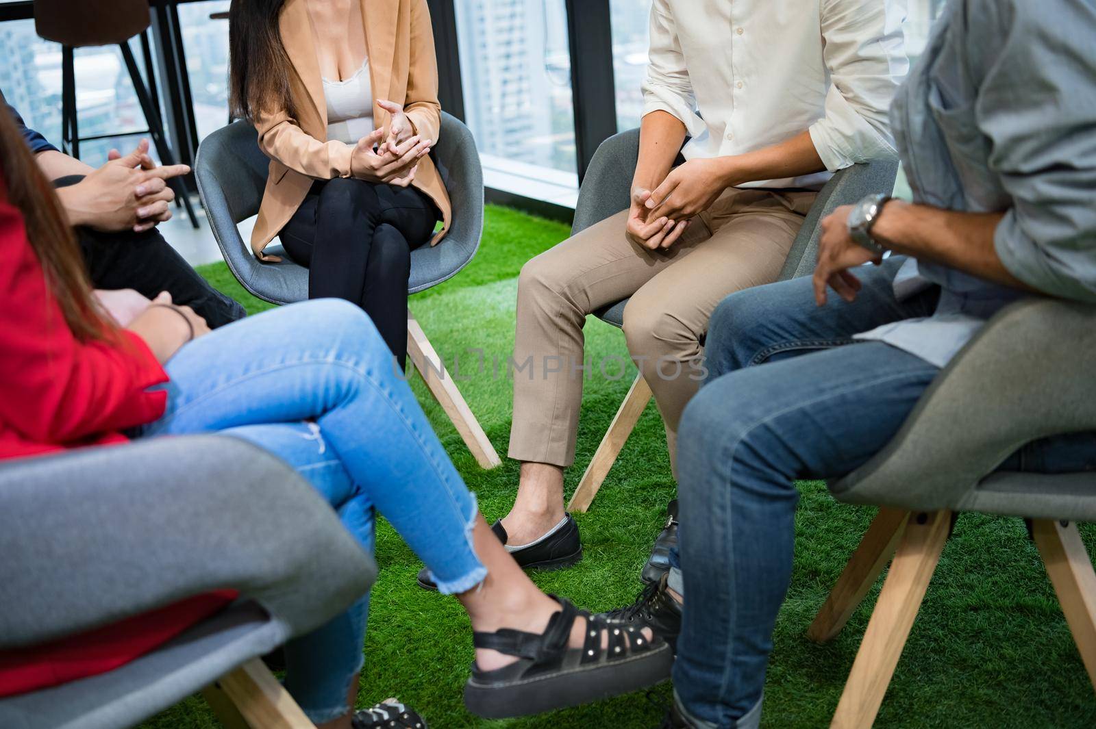 Psychotherapist inquiring about symptoms occurring within mind from patients with mental health problems in hospital. Group psychotherapy for support and helping worried man to change negative mindset