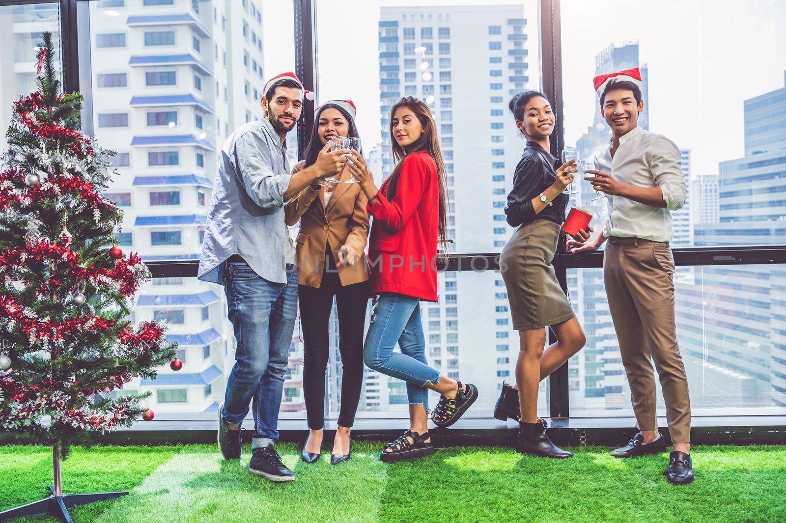 Group of business diversity colleague teamwork celebaring for New Year party in modern urban office background. Friends having enjoy party with alcoholivd drink together. Multi ethics people lifestyle