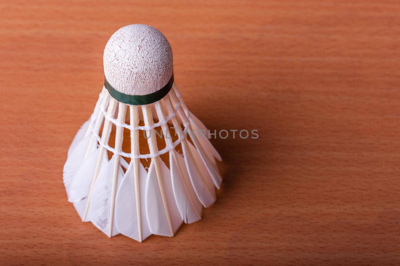 Badminton shuttlecock on wooden table. Sport and Athlete concept.