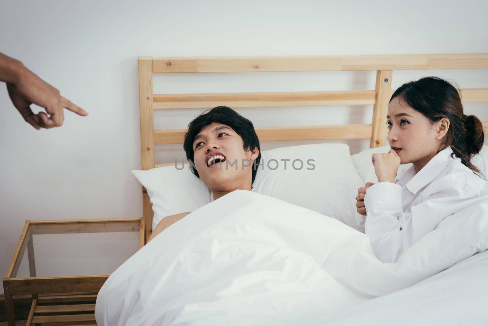 Asian adulterer and his unfaithful wife are indicated by marriage certificate husband. Paramour and divorce concept. Social problem theme. Asian people