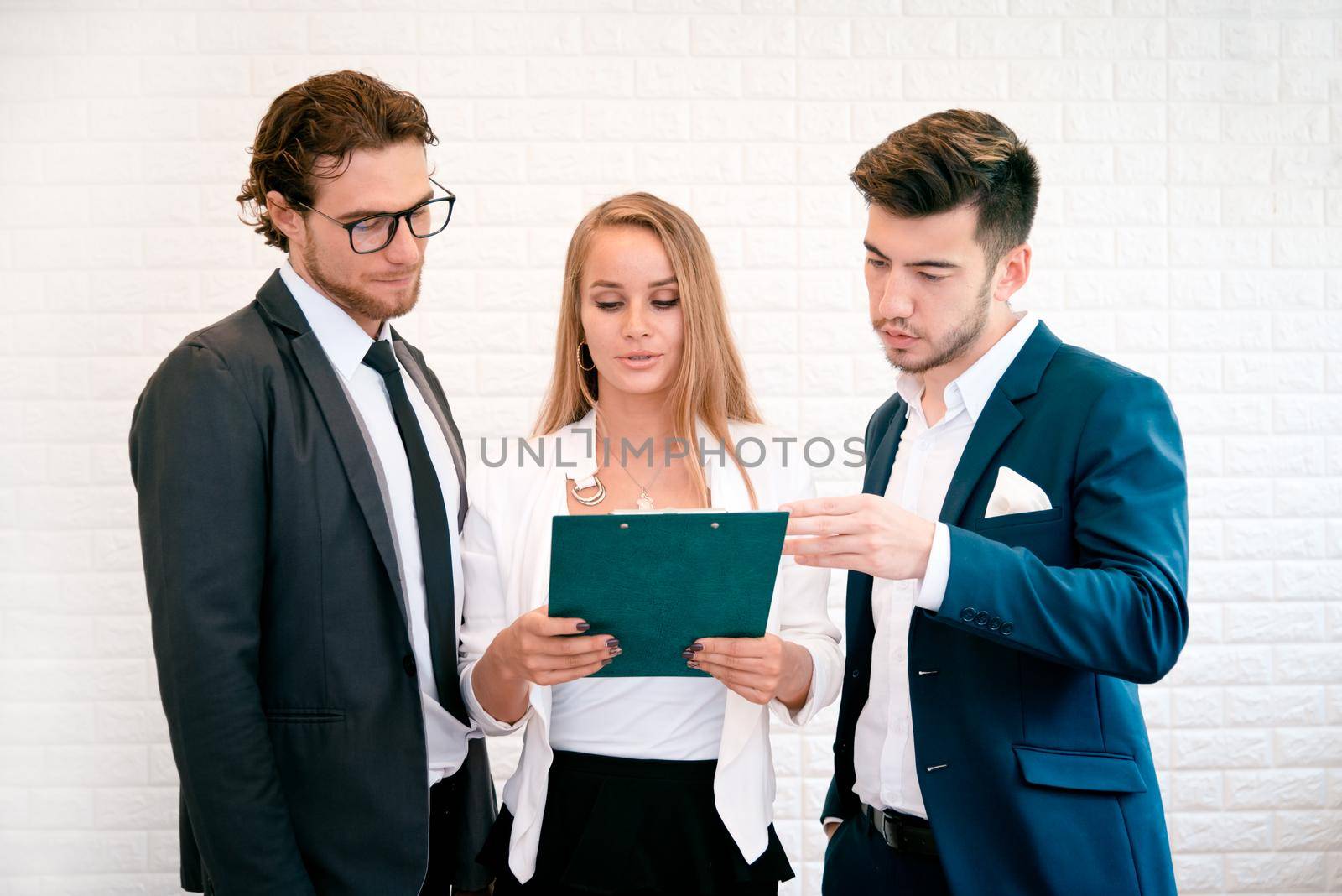 Three business people are looking at the summary report and consult together, Indoors  Businessman and Businesswoman concept, Meeting and consulting concept