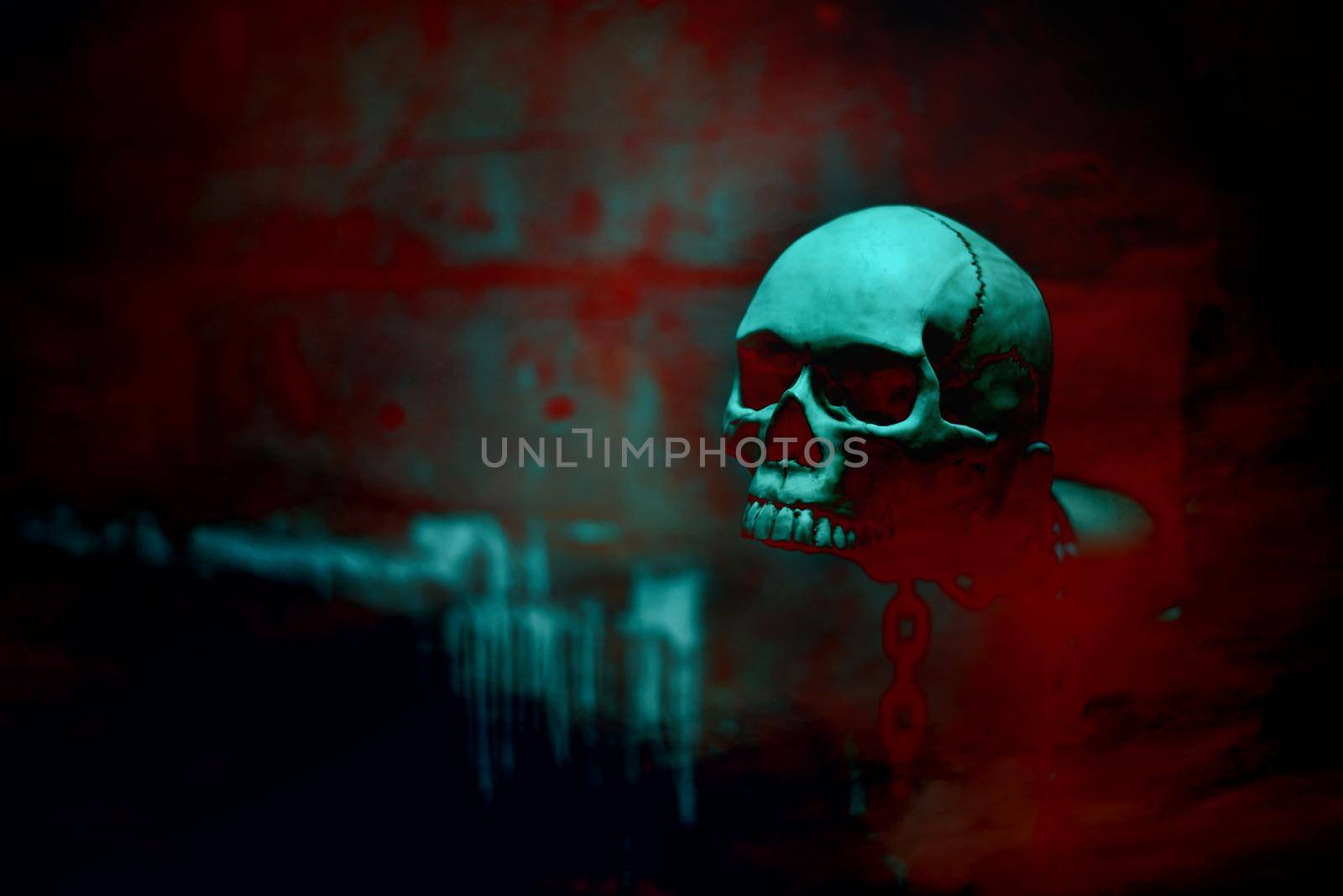 Skull skeleton with chain in red blood background, Halloween's day theme, Horror and dark film tone, Scary and screaming concept, Ghost and witch concept. Poster for Holiday's festival event.