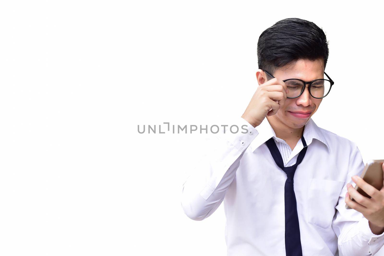 Business man wearing eyes glasses crying when using cell phone on isolated white background