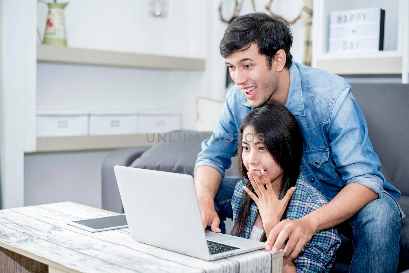 Lover are surprising when using the laptop. Family concept, Lovers concept, Technology concept