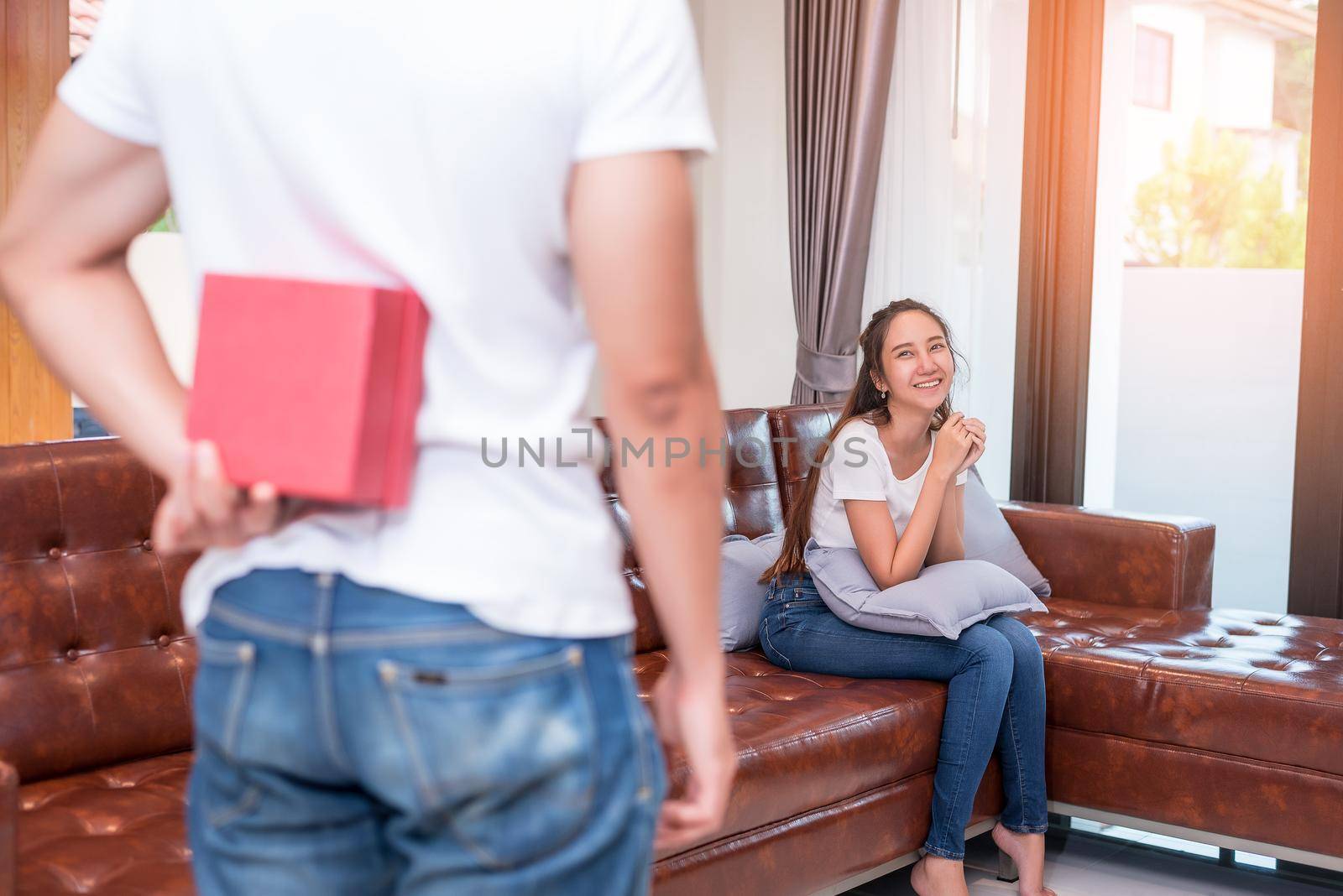 Man surprising woman in special day. Family and Lovers concept. Birthday and Valentine theme.