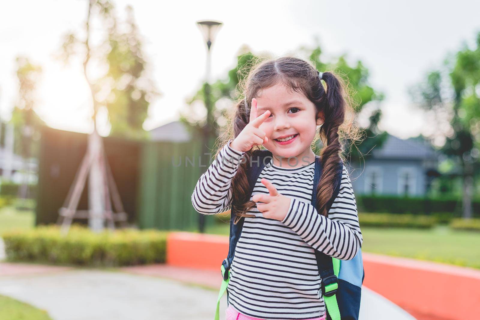 Happy little girl enjoy going to school. Back to school and Education concept. Happy life and family lifestyle theme.