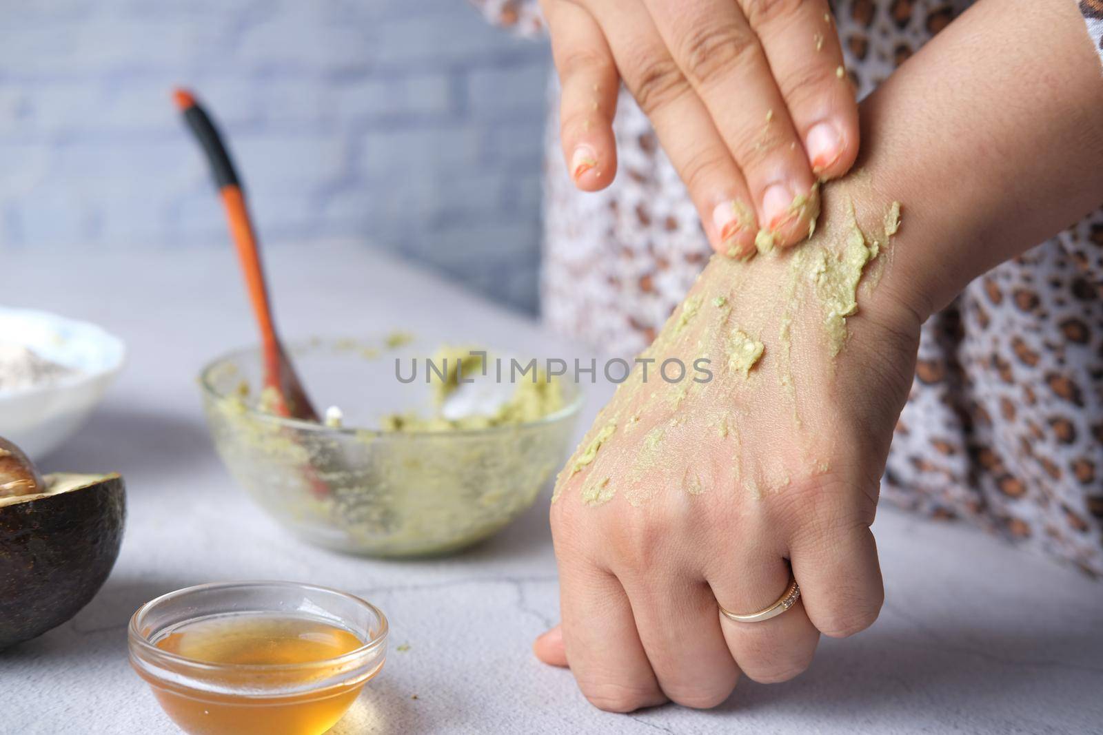 women applying homemade natural avocado cosmetic cream on skin, by towfiq007