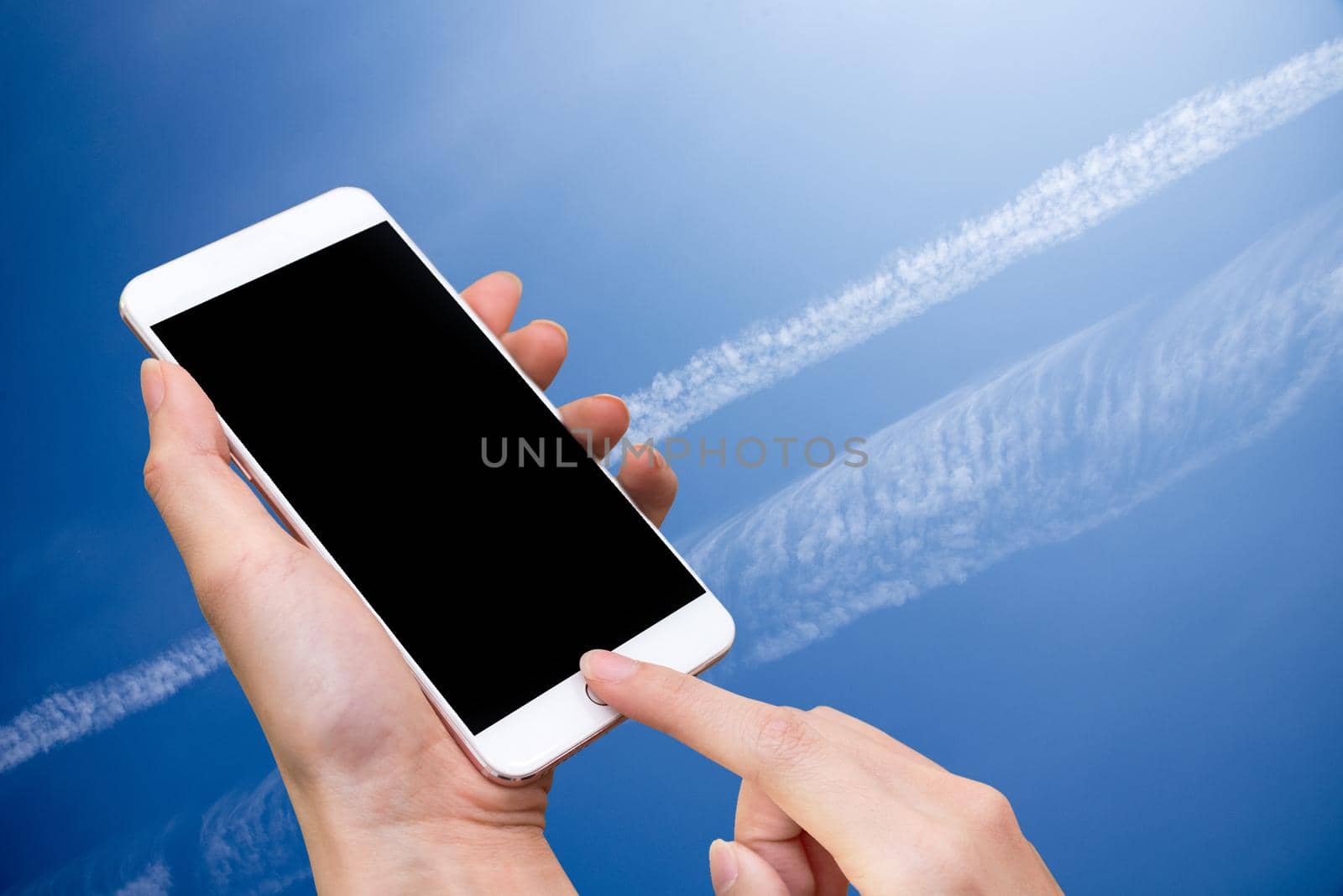 Woman hold smart phone and touch button by hand with blank screen for advertisement, Blue Sky and abstract background ,Technology and Nature concept