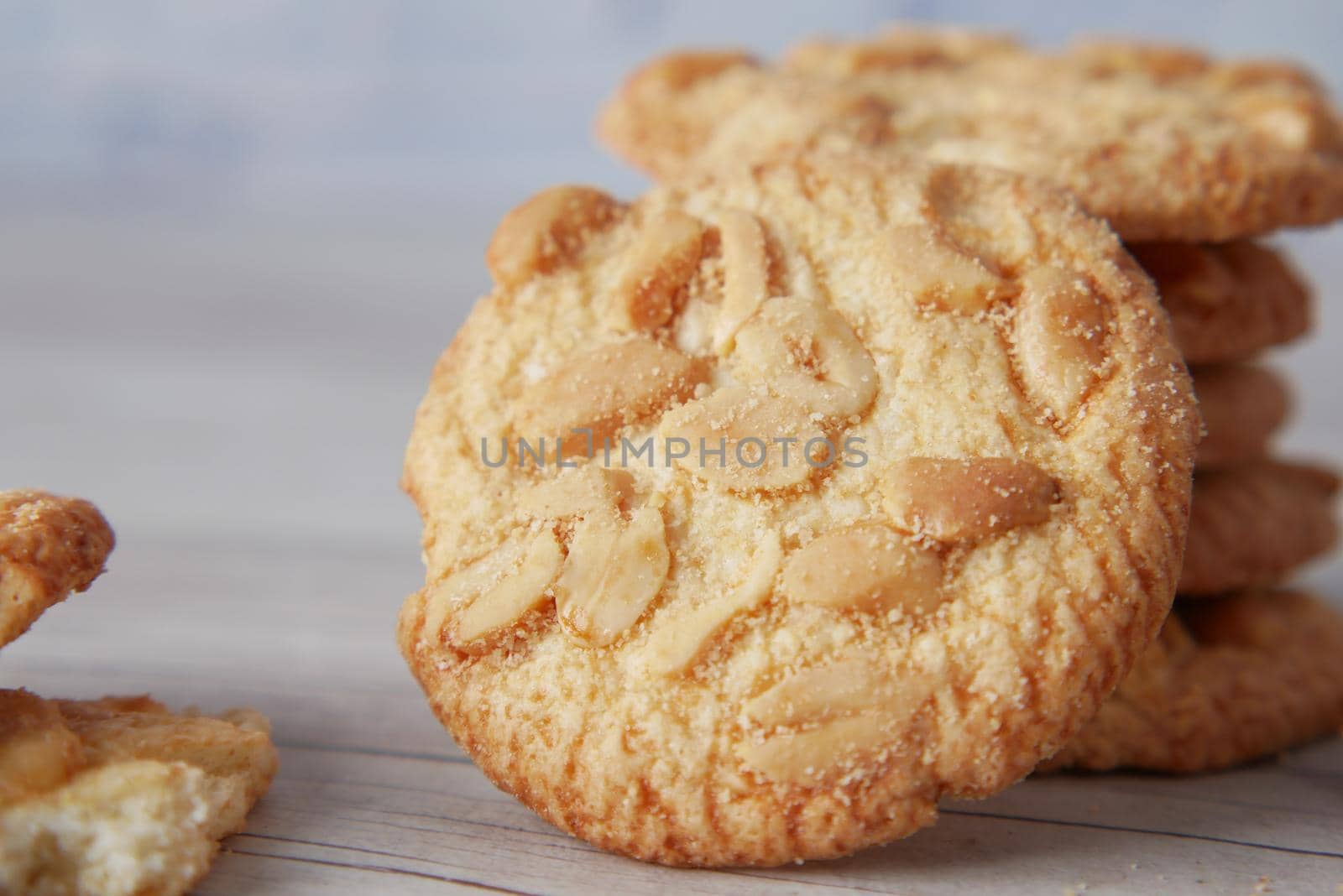 stack of peanut cookies on wooden background.