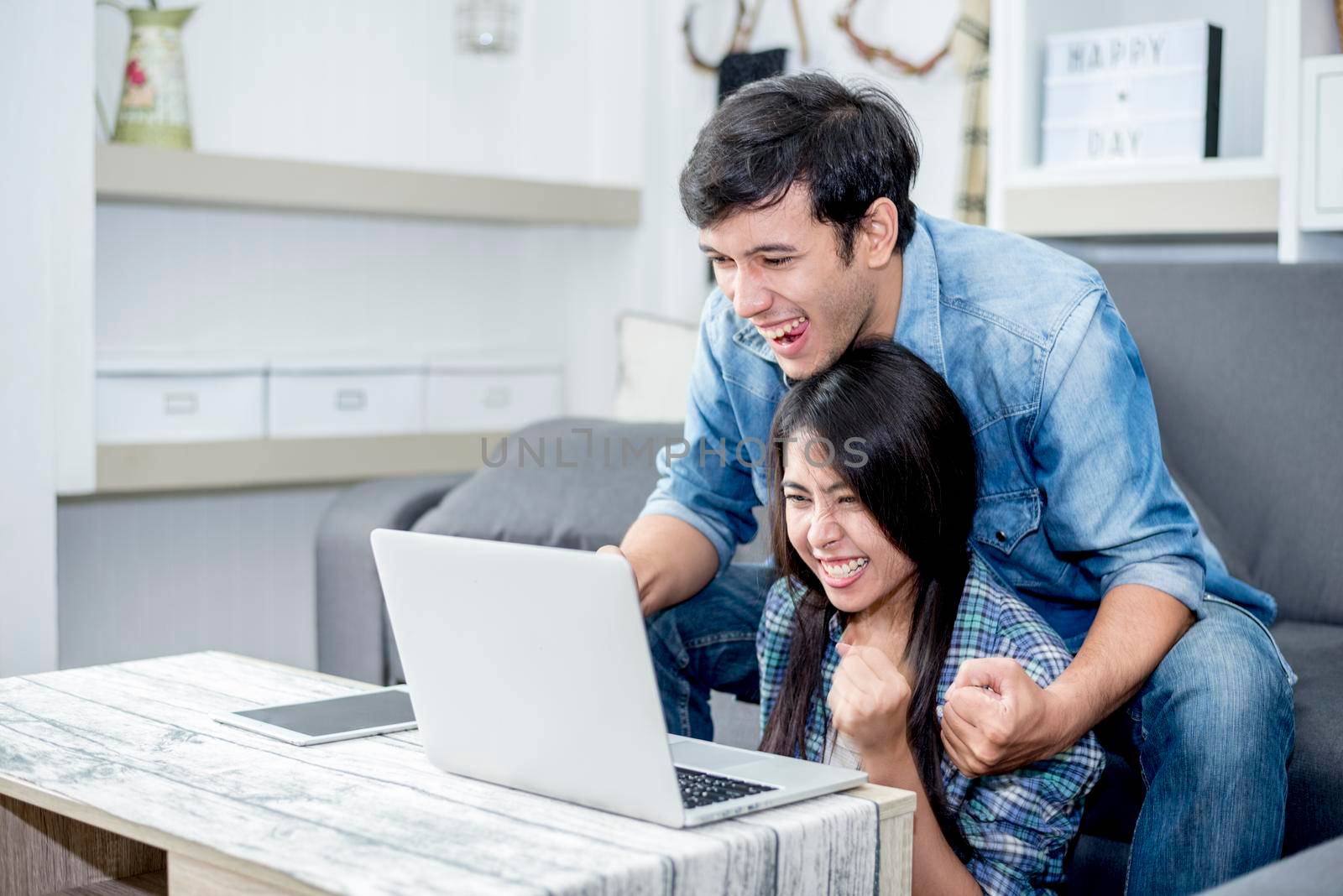 Lover are surprising when using the laptop. Family concept, Lovers concept, Technology concept