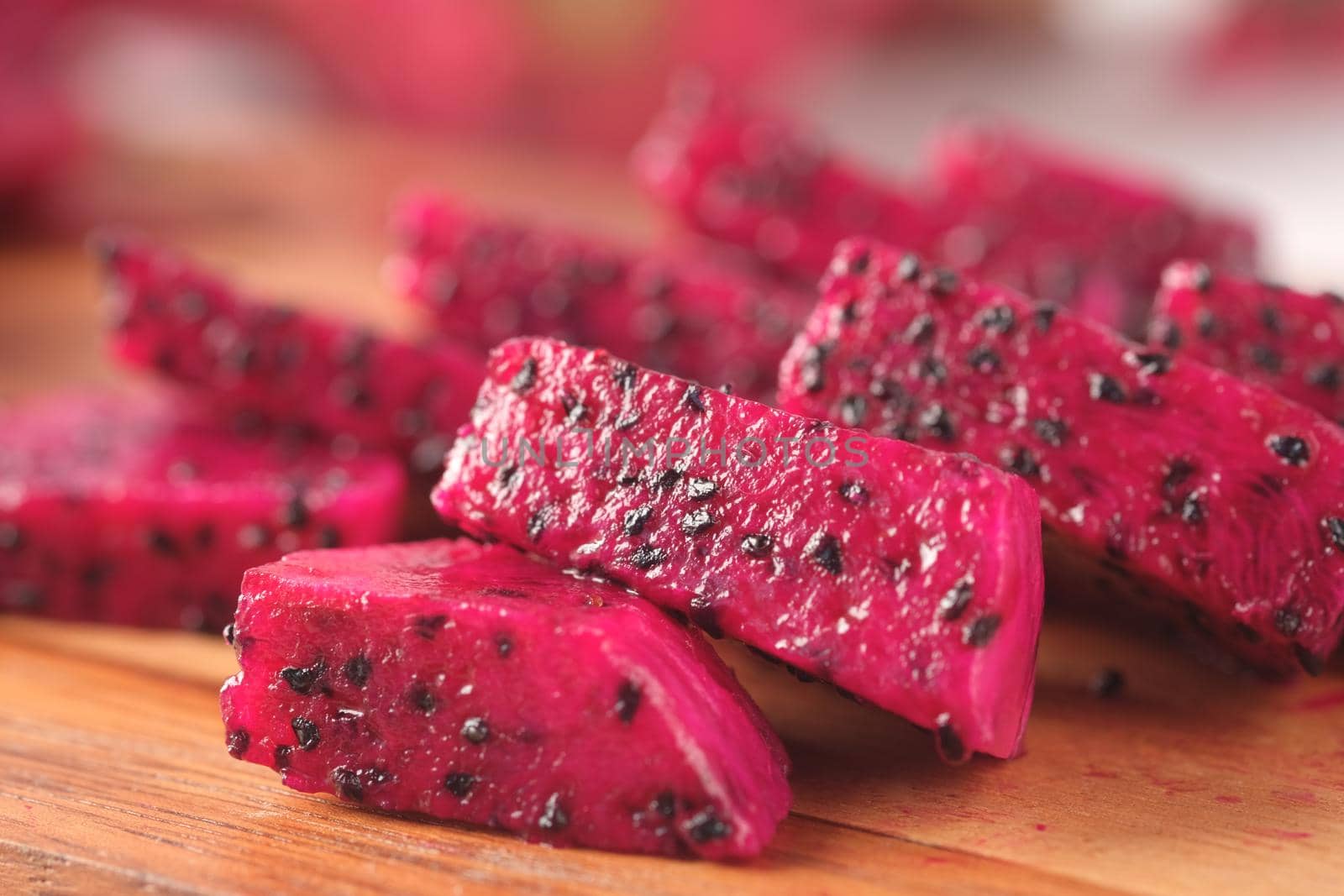 slice of dragon fruit on a chopping board.,