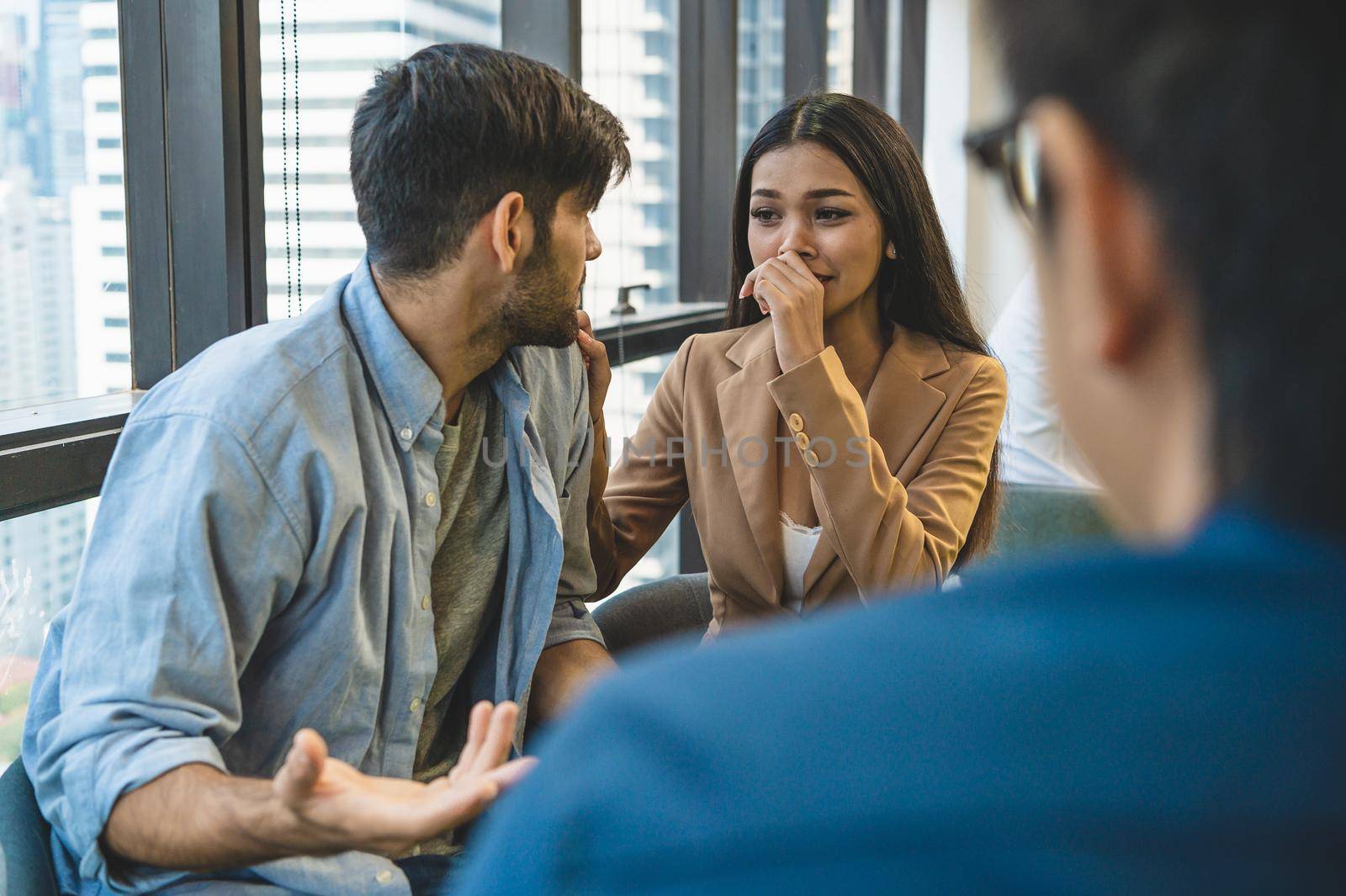 Psychotherapist inquiring about symptoms occurring within mind from couple patients with mental health problems. Group psychotherapy for support and helping worried man to change negative mindset