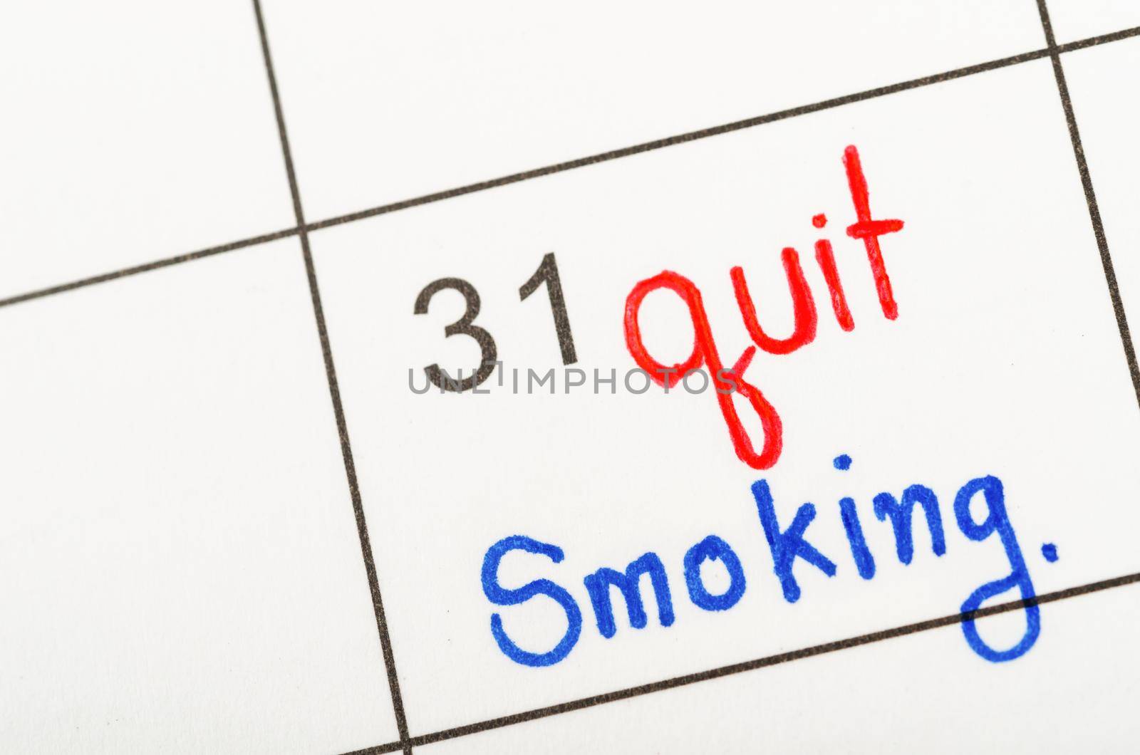 The words Quit Smoking written in calendar to remind you an important appointment.