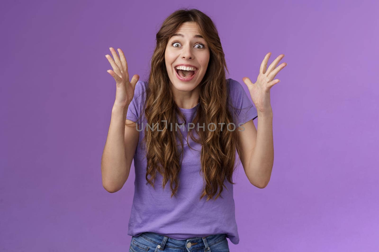 Cheerful surprised happy girl receive unbelievable super prize winning triumphing smiling joyfully shake hands excitement joy celebrating perfect news grinning happily victory purple background by Benzoix