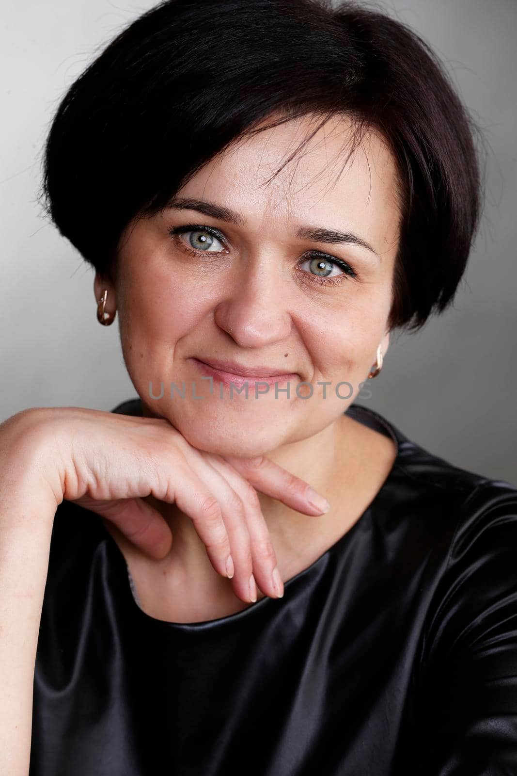 Portrait of a beautiful middle-aged woman. European style blue eyed brunette