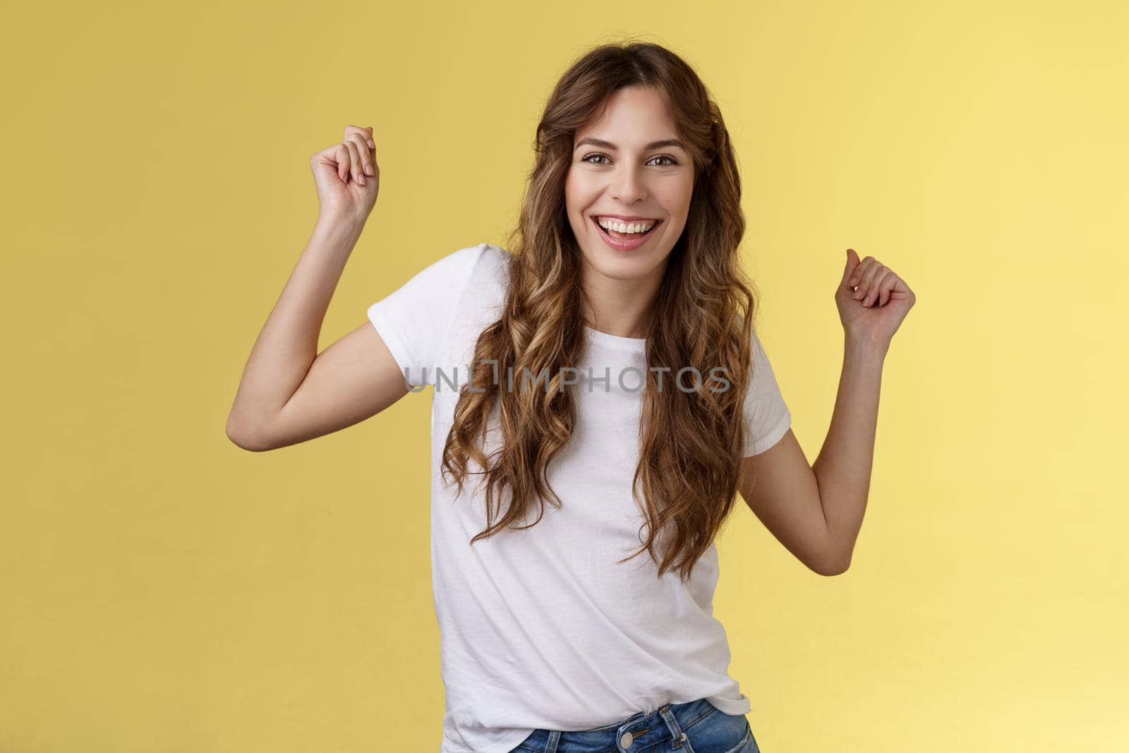 Oh yes check out my moves. Cheeky stylish good-looking young woman having fun party all night smiling delighted dancing lift hands up fist pump celebration success gesture grinning satisfied.