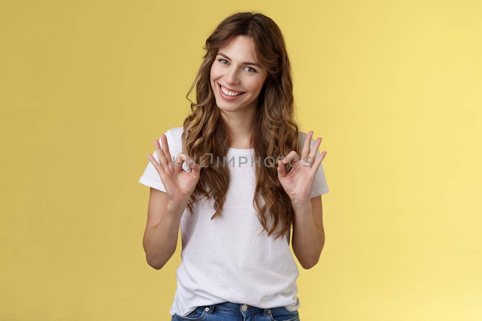 Not bad for newbie. Cunning good-looking young creative female colleague guarantee excellent result show okay ok approval gesture, assure friend everything perfect stand yellow background assertive by Benzoix