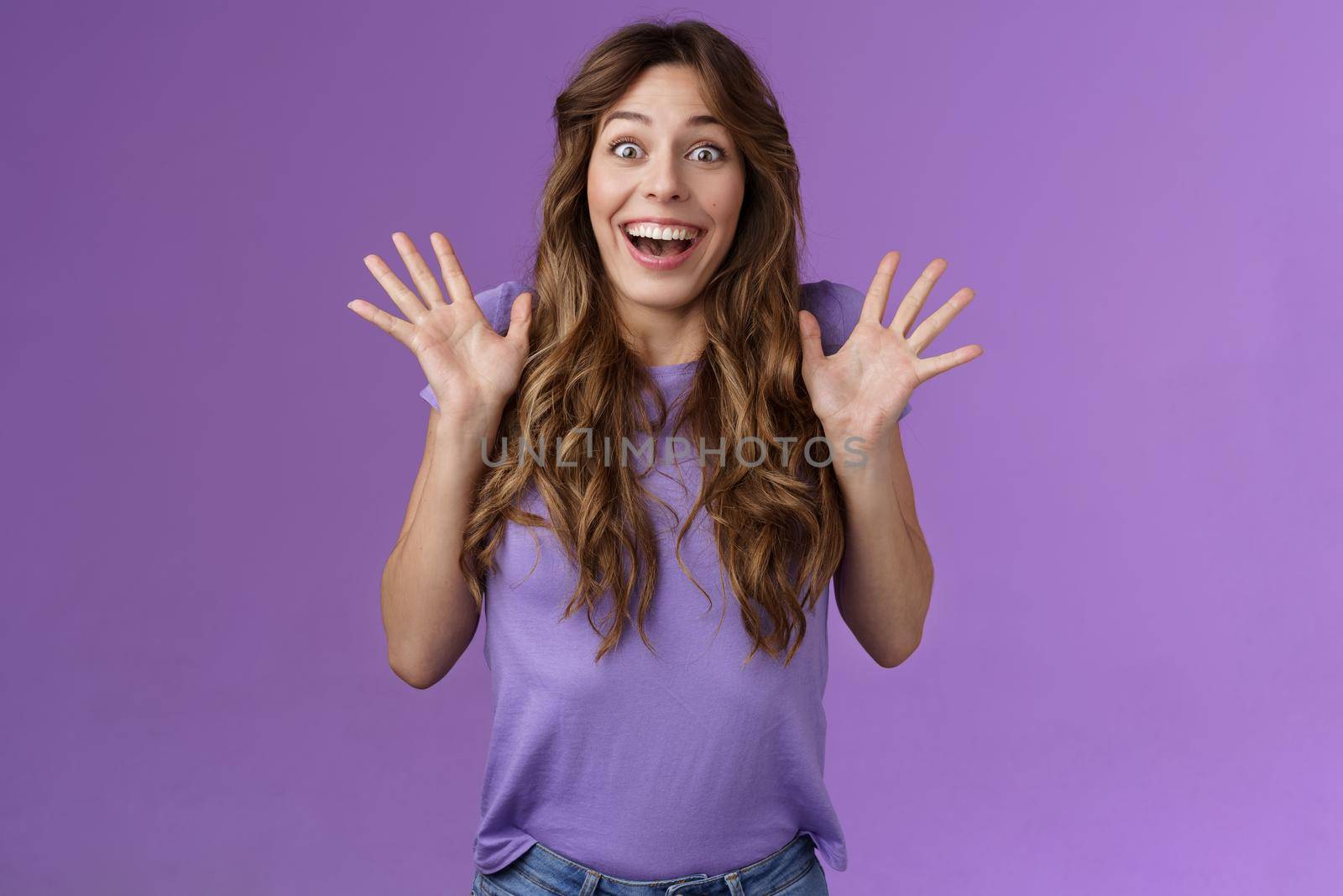 Impressed excited enthusiastic attractive lively girl celebrating good news gesturing shaking hands thrill joy smiling broadly found out great perfect event grinning joyfully purple background.
