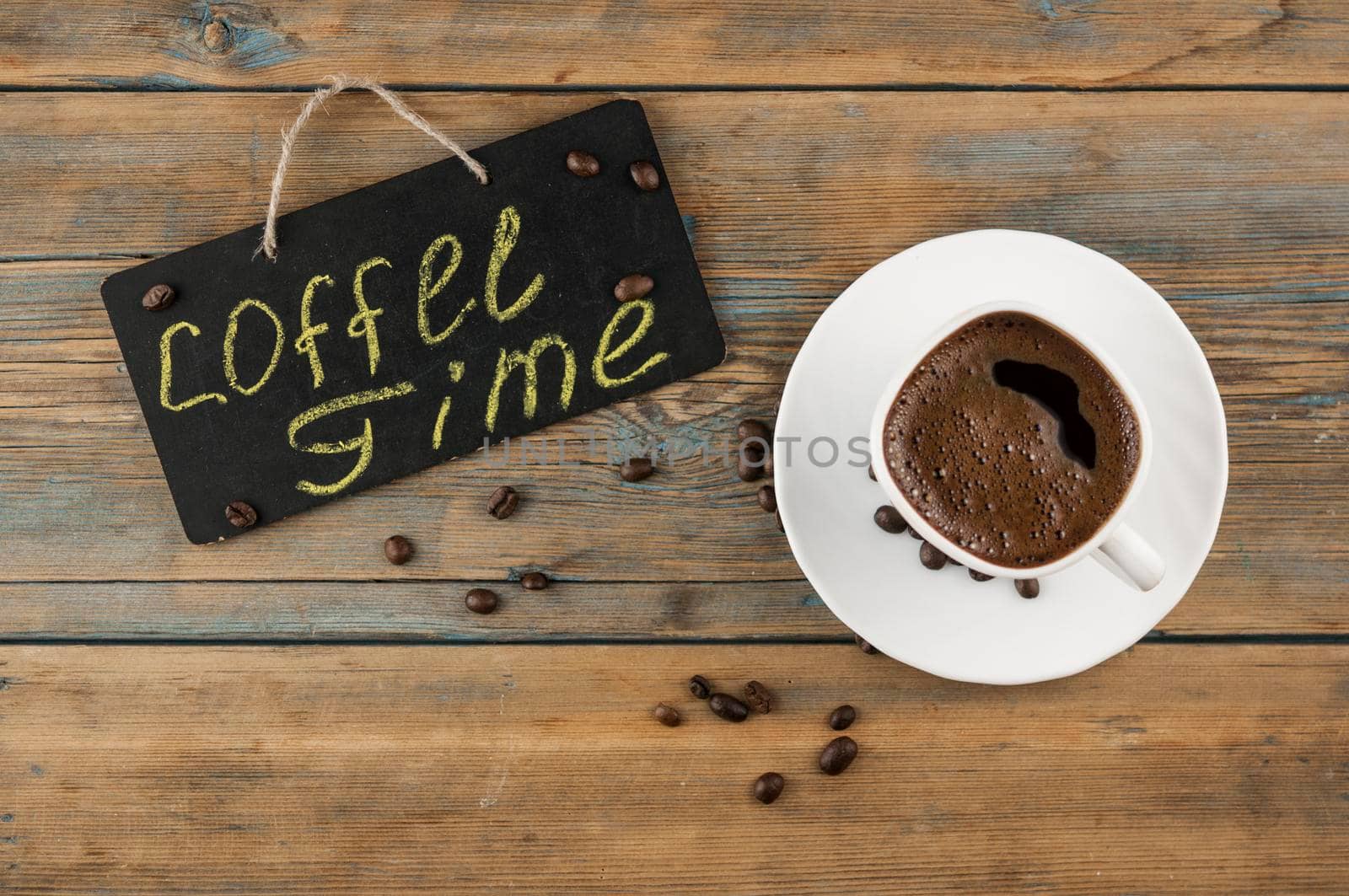 A cup of coffee and blackboard with inscription "coffee time". Coffee break, morning awakening concept. by inxti