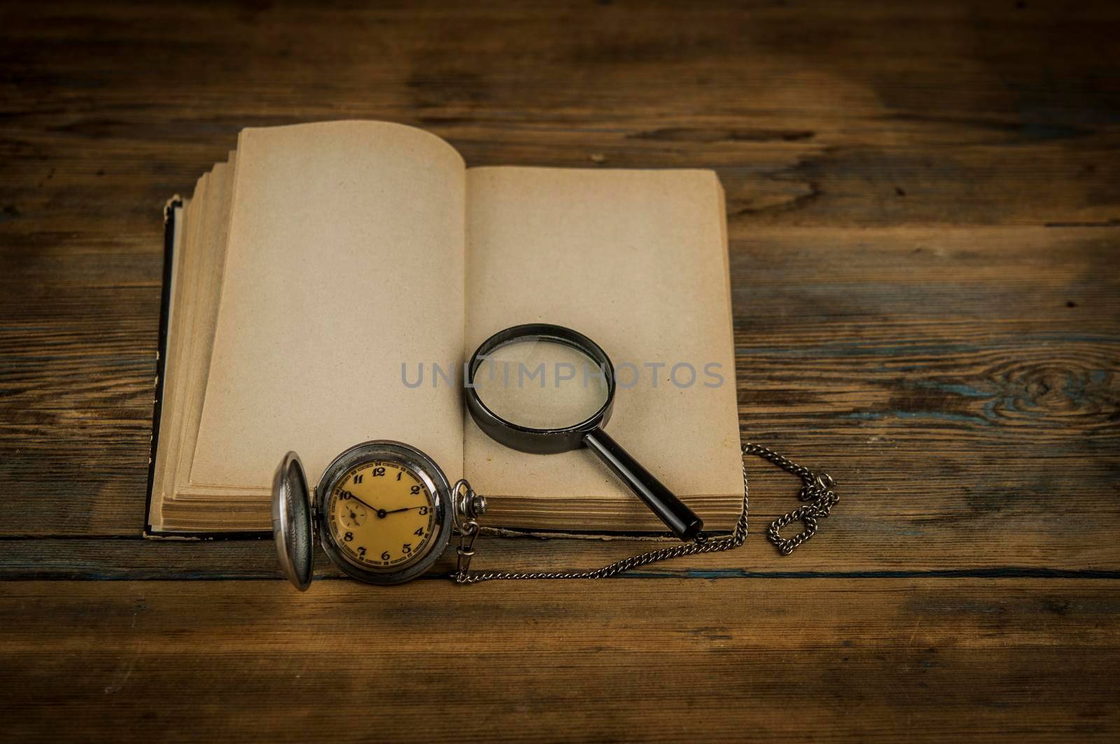 Old vintage books and a watch by inxti