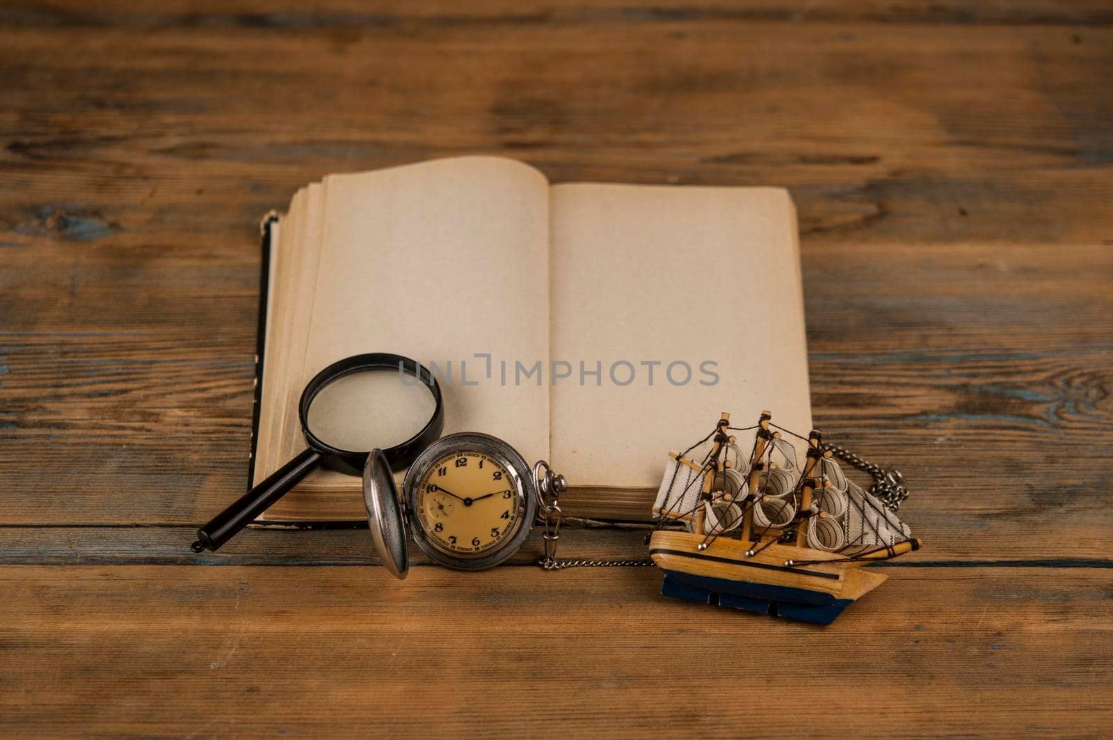Old vintage books and a watch by inxti