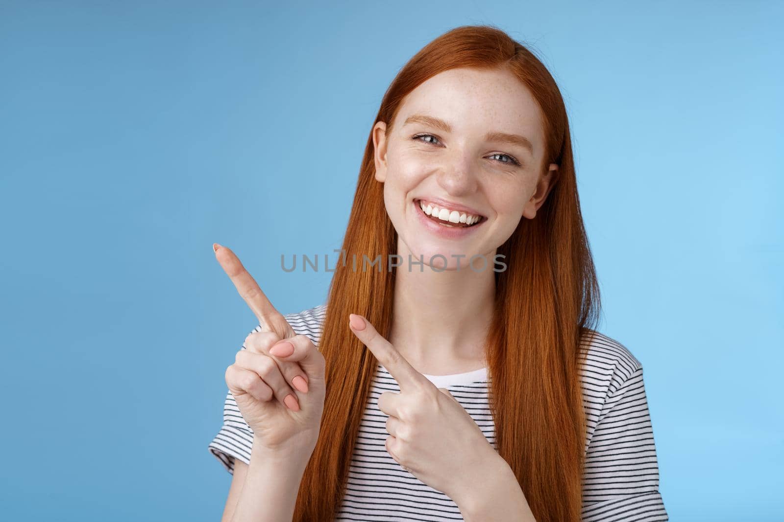 Charismatic friendly pretty redhead outgoing girl hang out friends showing good place sit enjoy meal pointing upper left corner smiling laughing happily have fun recommend promo, advertising by Benzoix