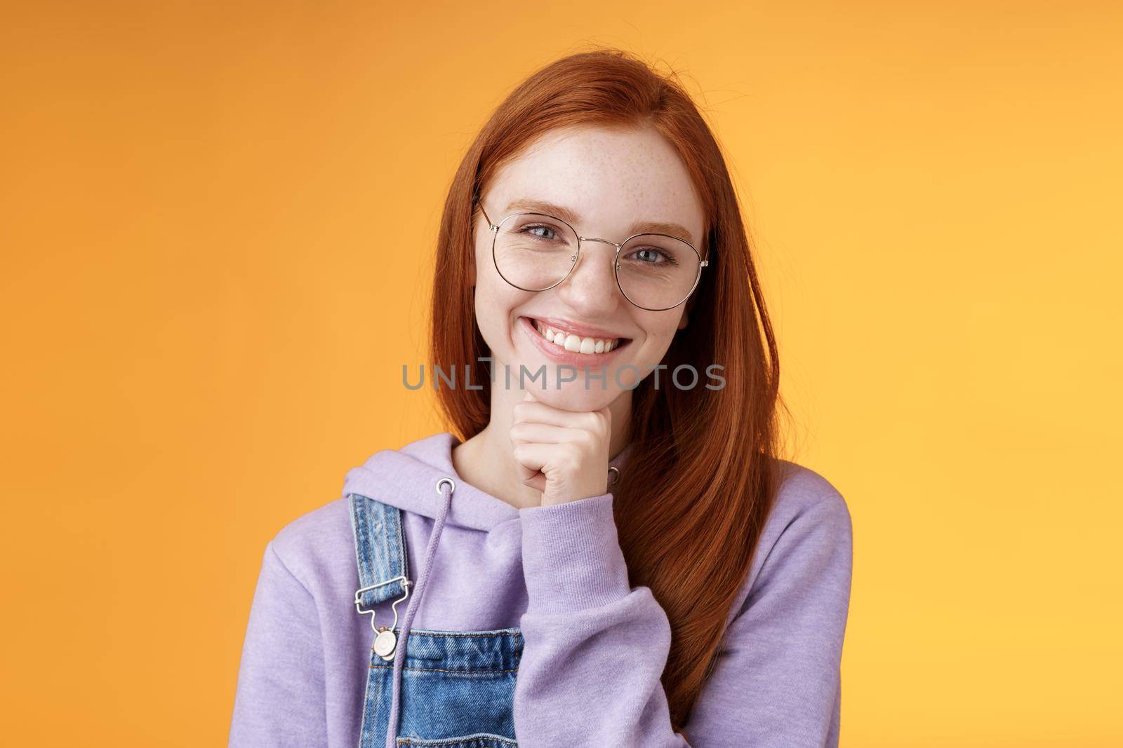 Creative outgoing young charismatic redhead female coworker discuss casual staff smiling laughing happily have pleasant conversation look camera amused tender touch chin, orange background by Benzoix