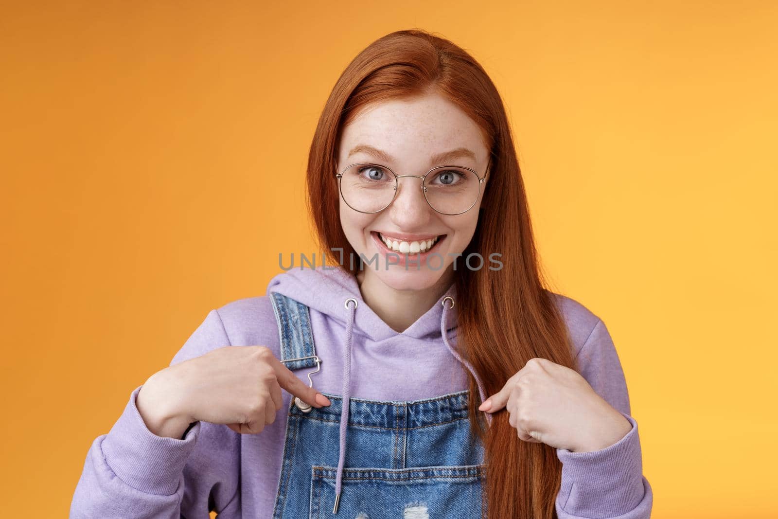 Surprised happy pleased happy smiling young redhead girl getting awesome proposal grinning questioned pointing herself laughing full disbelief receive promotion unbelievable chance. Copy space