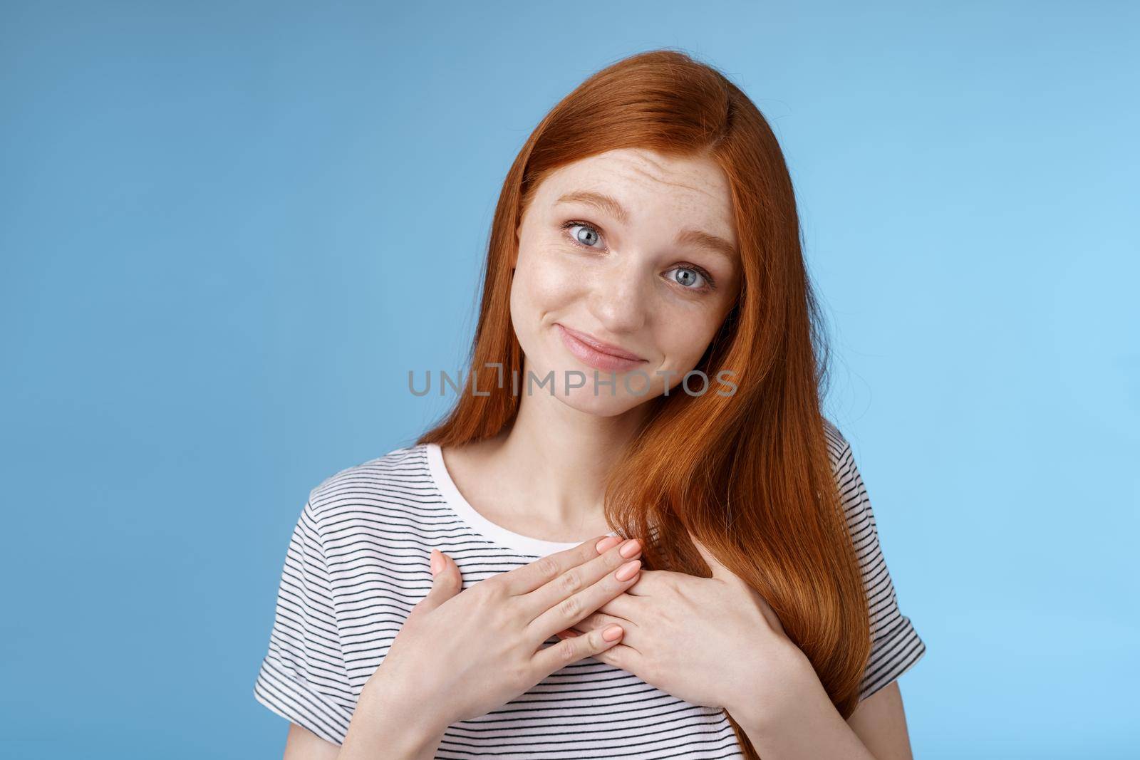 Kind tender sincere cute caucasian redhead girl melting go speechless heartwarming precious moment touched moving gift received compliment smiling delighted press palms grateful, thankful by Benzoix