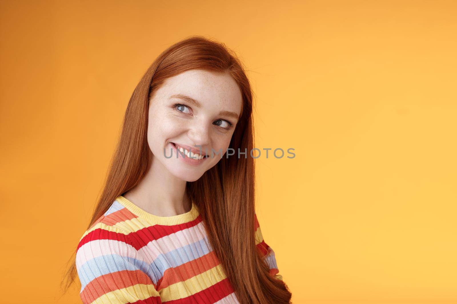 Silly flirty good-looking redhead girl making first move checking out guy standing profile turning left smiling intrigued glancing aside coquettish flirting seducing sassy, orange background by Benzoix