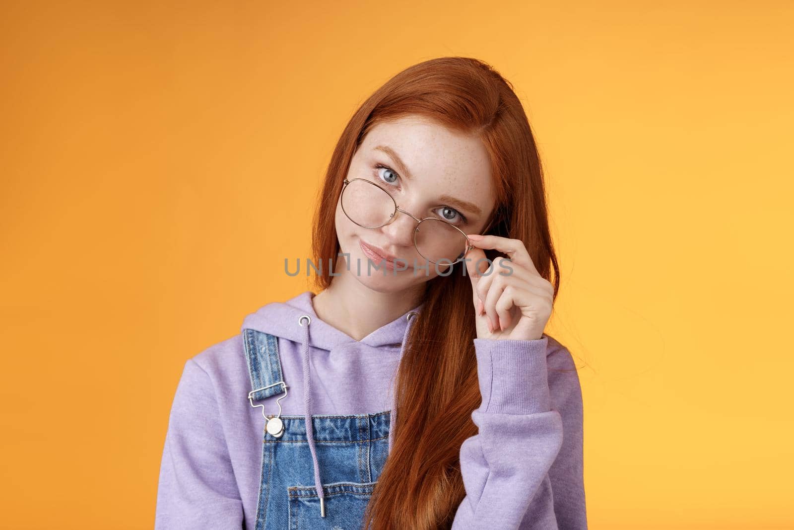 You gotta be kidding me. Annoyed redhead smart irritated elder sister look from under forehead take off glasses roll eyelids smirking disturbed pissed stupid jokes, standing orange background by Benzoix
