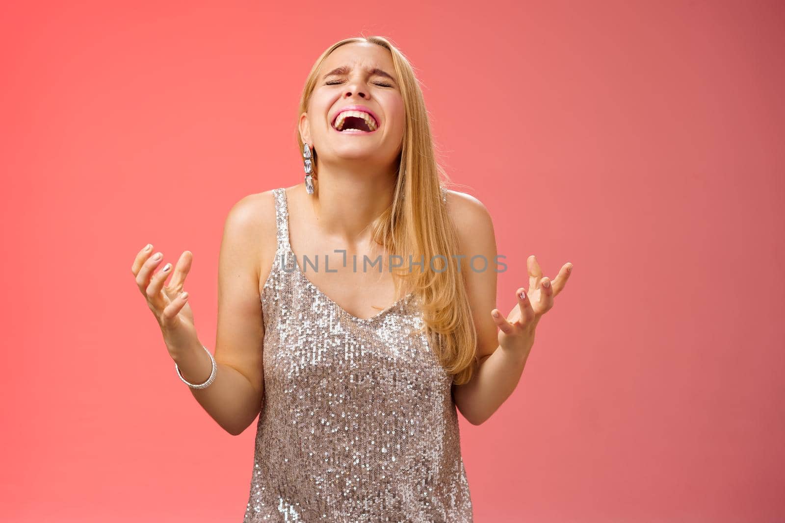 Relieved happy charming blond woman thank god shouting yes celebrating rejoicing win standing red background close eyes laughing happiness clench fists victory triumph gesture, dream came true.
