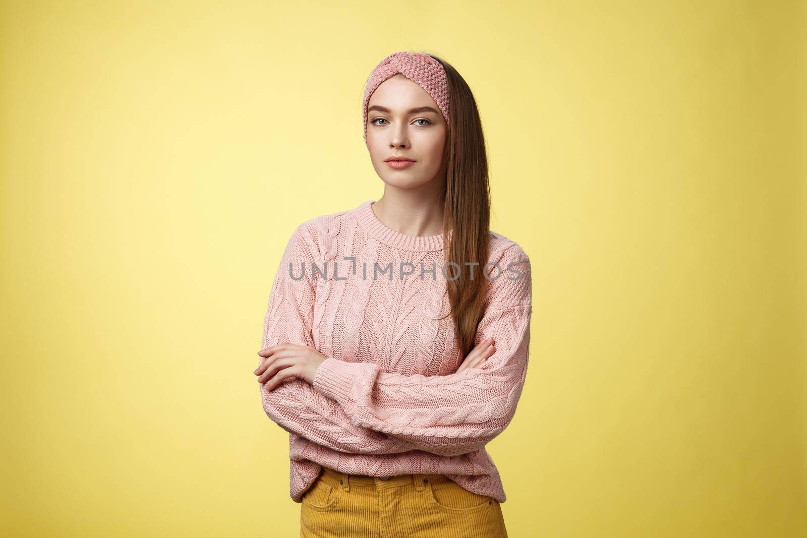 Try me. Confident glamour young female beauty salon manager cross hands over chest looking confident and sassy with self-assured smirk. Girl student posing against yellow background encouraged.