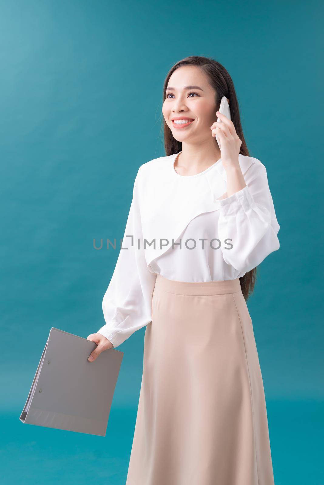 business people, technology and corporate concept - businesswoman or realtor with folder calling on smartphone at office
