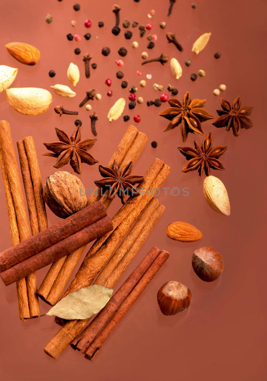 Traditional Christmas spices - Star anise with cinnamon and cloves on wooden background
