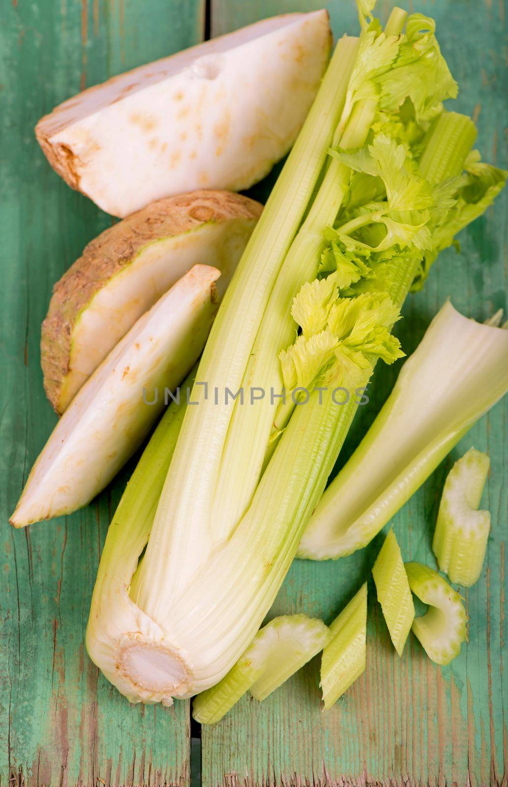 Fresh root and leaves celery on wood by aprilphoto