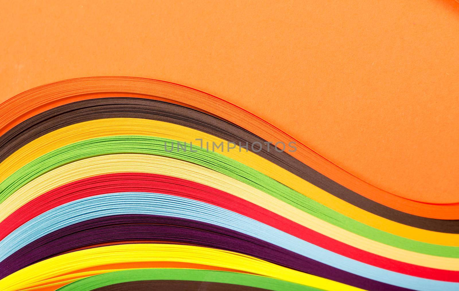 Colored paper, cross section, background stacked in wedges. by aprilphoto