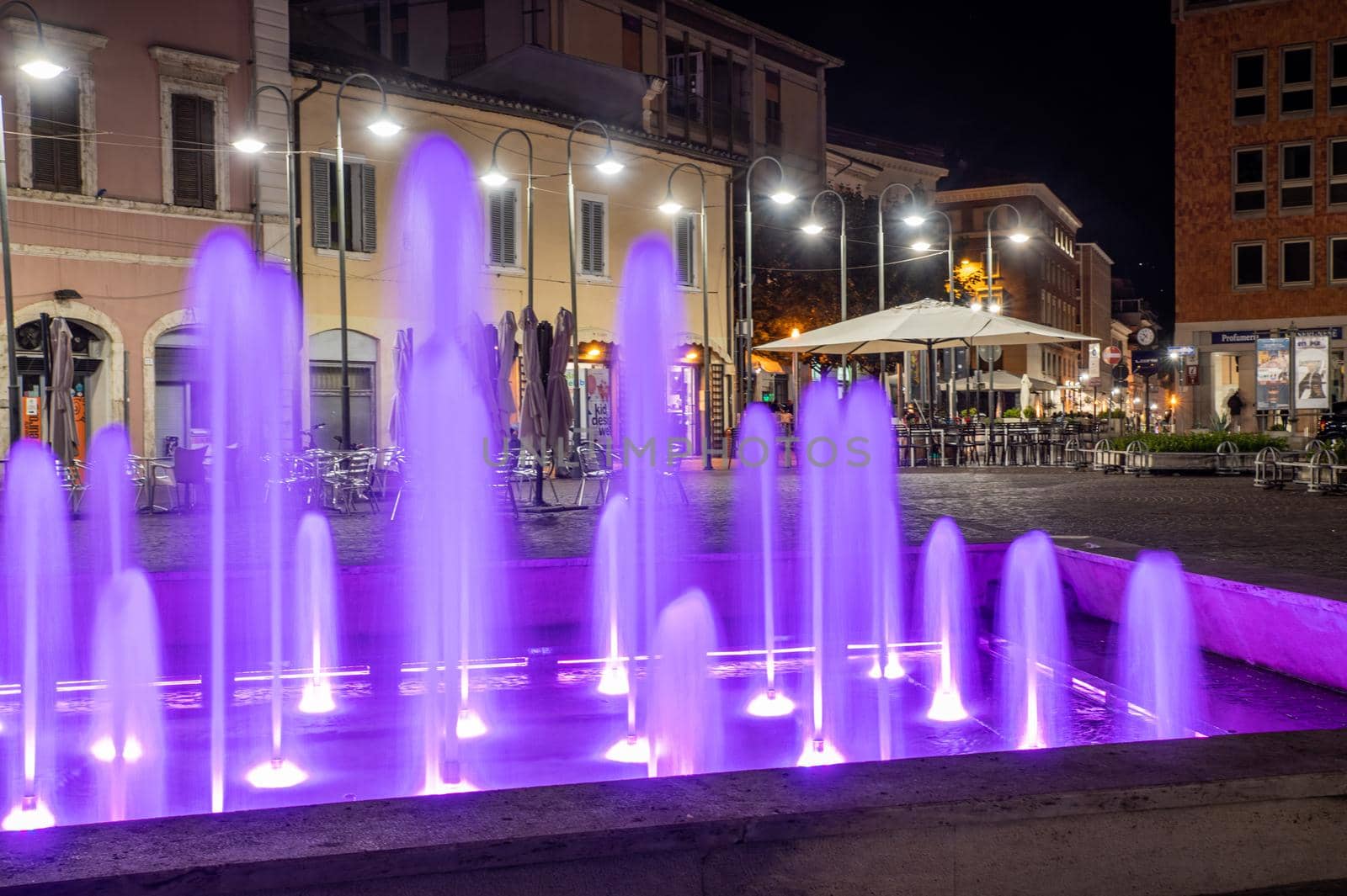 terni,italy october 12 2021:fountain of the town of terni illuminated in pink