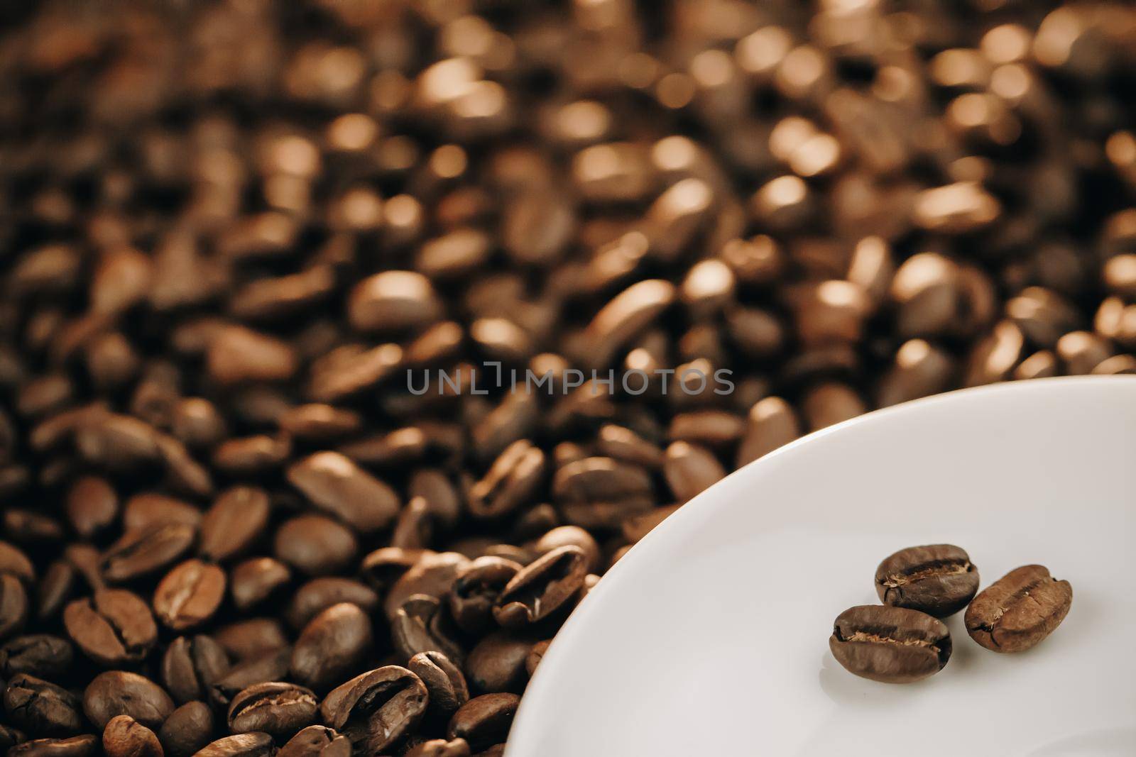 Three shiny fresh roasted coffee beans. Coffee Beans Background. Close Up by uflypro