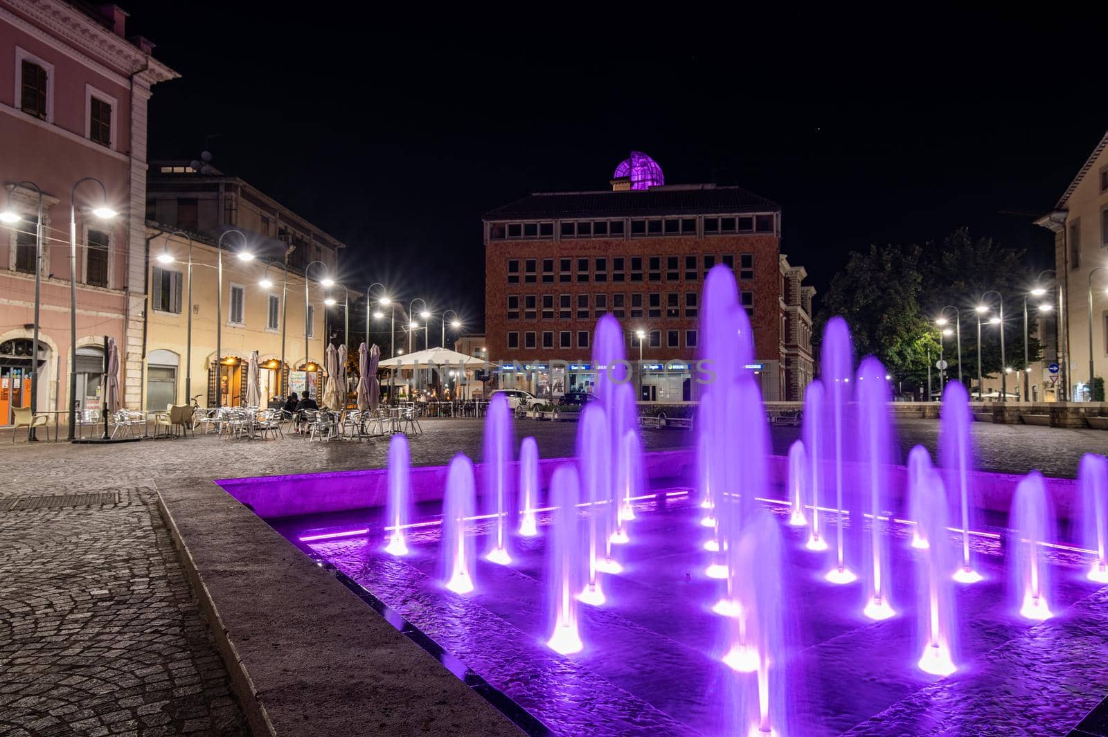 terni,italy october 12 2021:fountain of the town of terni illuminated in pink