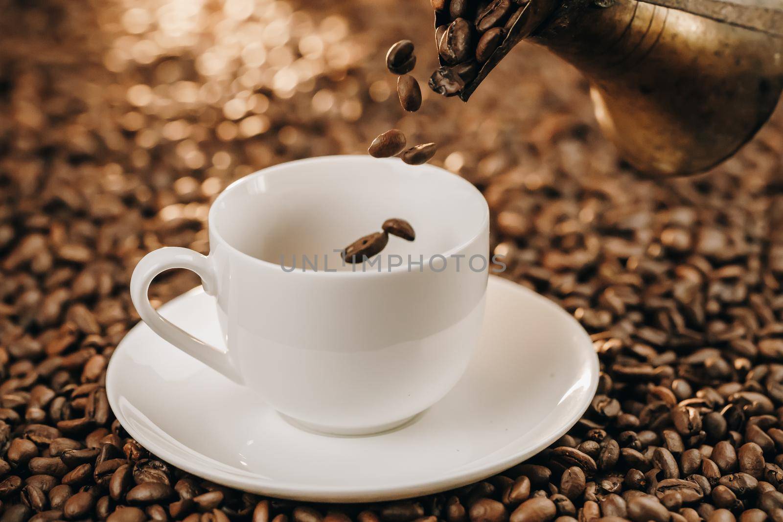 Pouring turkish coffee into vintage cup on wooden background