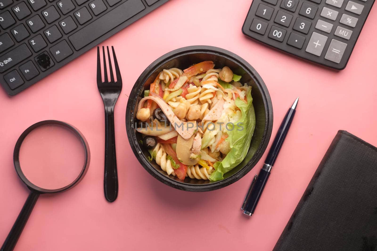 fresh vegetable salad in bowl on office desk by towfiq007