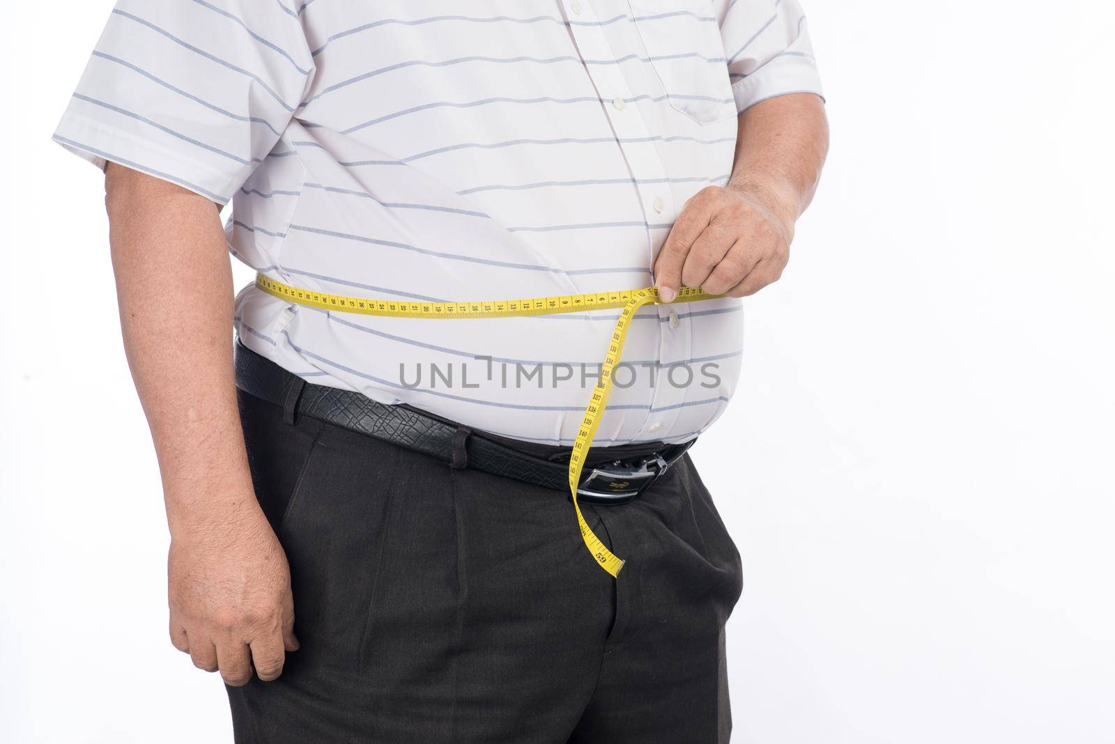 Fat mature man measuring his belly with measurement tape, isolated on white background by makidotvn