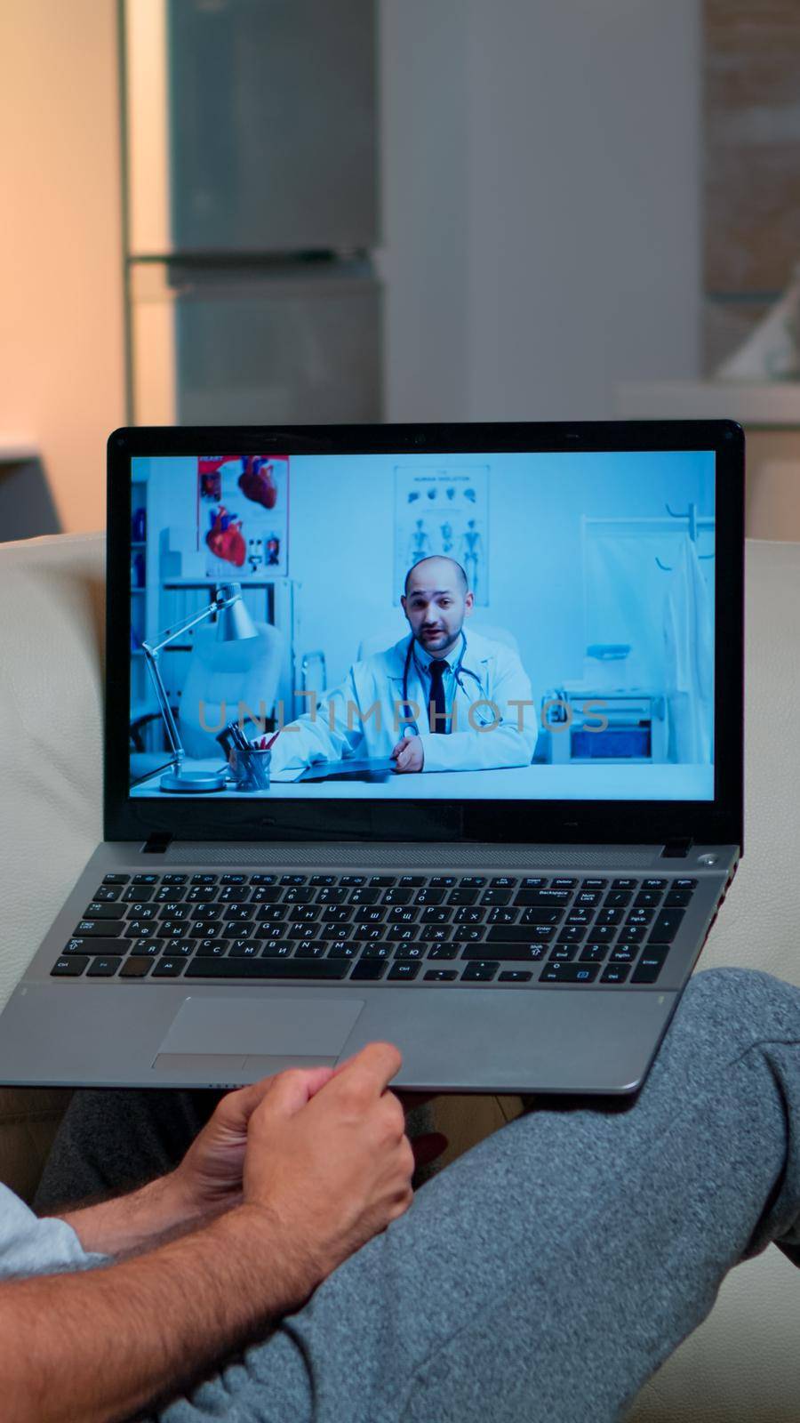 Sick man having online telemedicine consultation during covid-19 by DCStudio